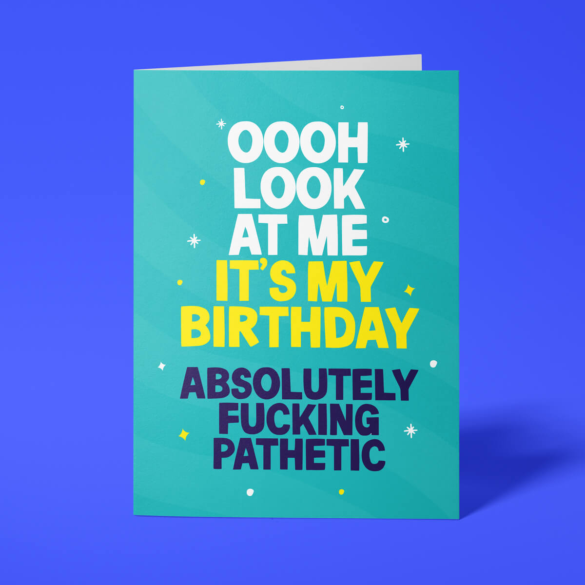 Funny birthday card reading 'Oooh Look At Me It's My Birthday Absolutely Fucking Pathetic' — teal background with yellow accent text, bold block design — Wottahoot