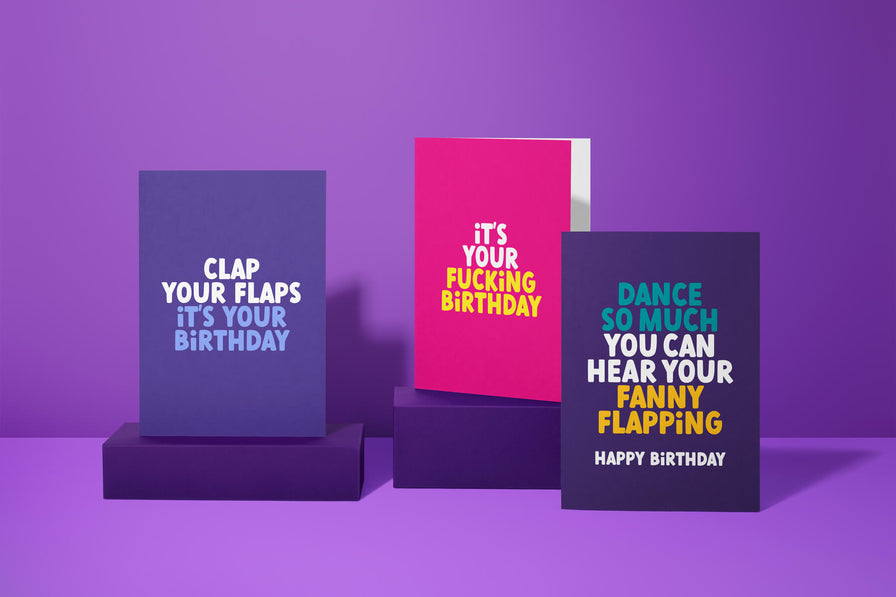 Rude Birthday Cards. Image shows 3 Rude Cards, from the left, Clap Your Flaps it's your Birthday, It's your fucking birthday and Dance so much you can hear your fanny flapping, rude cards