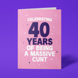 Rude 40th birthday card reading 'Celebrating 40 Years Of Being A Massive Cunt' — pink background with navy number, bold white block text — Wottahoot