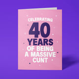Rude 40th birthday card reading 'Celebrating 40 Years Of Being A Massive Cunt' — pink background with navy number, bold white block text — Wottahoot