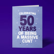 Rude 50th birthday card reading 'Celebrating 50 Years Of Being A Massive Cunt' — pale lilac background with navy number, bold white block text — Wottahoot
