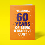 Rude 60th birthday card reading 'Celebrating 60 Years Of Being A Massive Cunt' — orange background with navy number, bold white block text — Wottahoot