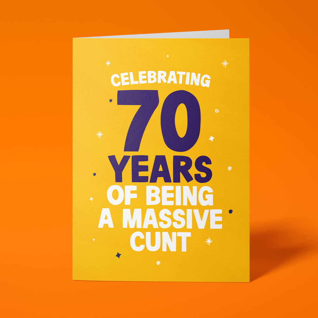 Rude 70th birthday card reading 'Celebrating 70 Years Of Being A Massive Cunt' — yellow background with navy number, bold white block text — Wottahoot