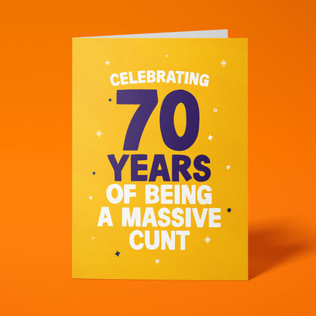 Rude 70th birthday card reading 'Celebrating 70 Years Of Being A Massive Cunt' — yellow background with navy number, bold white block text — Wottahoot