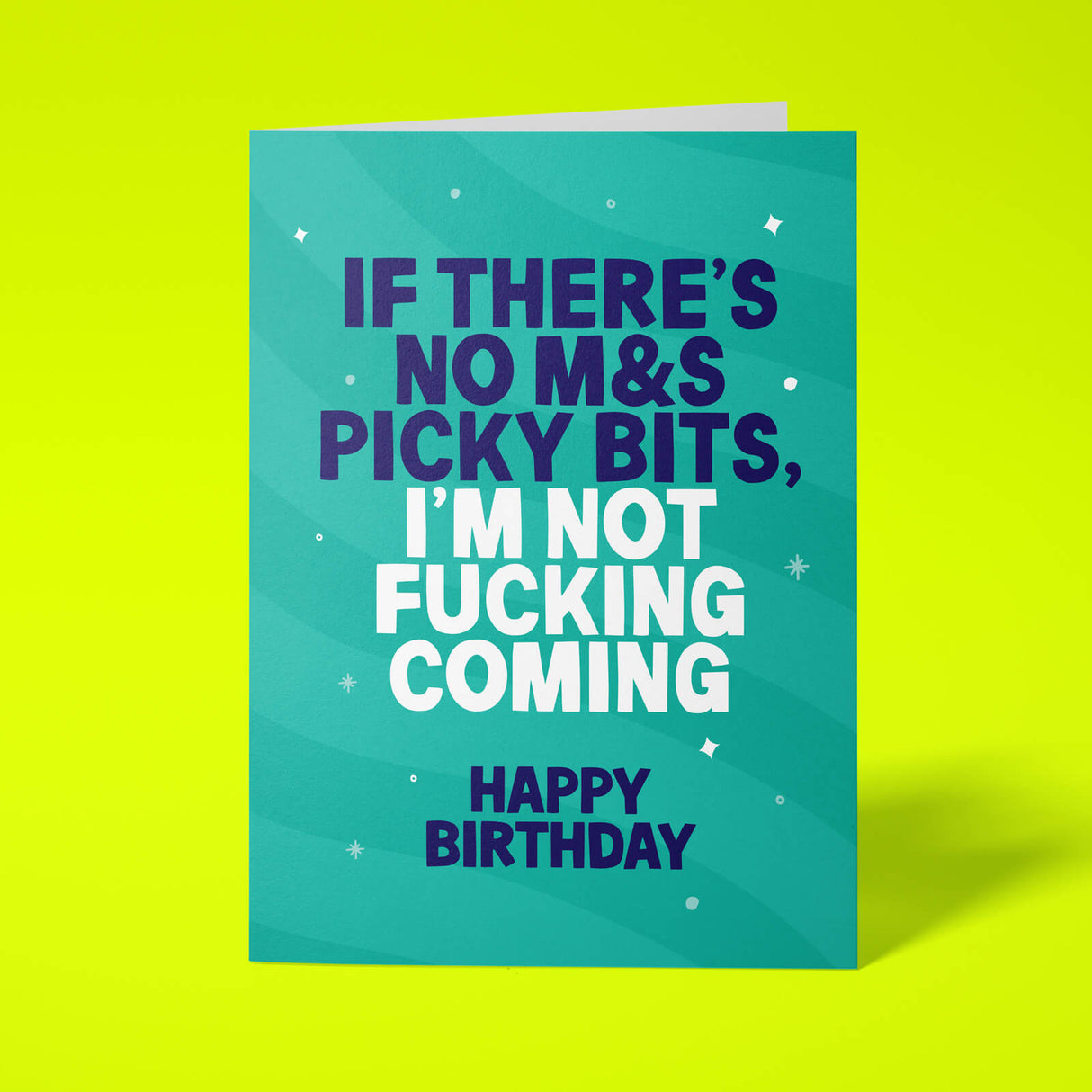 A square greeting card with a teal background and bold text reading 'IF THERE'S NO M&S PICKY BITS, I'M NOT FUCKING COMING HAPPY BIRTHDAY' in dark blue and white, shown on a bright yellow background.