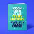 Funny birthday card reading 'Oooh Look At Me It's My Birthday Absolutely Fucking Pathetic' — teal background with yellow accent text, bold block design — Wottahoot