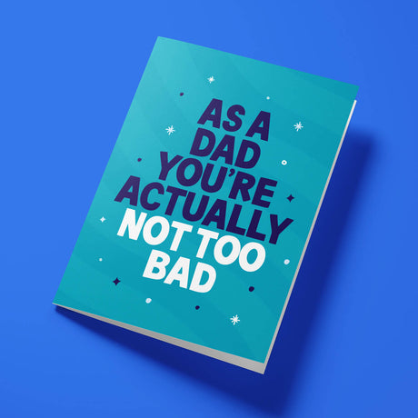Funny Father's Day card reading 'As A Dad You're Actually Not Too Bad' — teal background, bold block text — Wottahoot