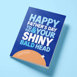 Funny Father's Day card for bald dad reading 'Happy Father's Day To You & Your Shiny Bald Head' — navy blue background with illustrated bald head, bold block text — Wottahoot
