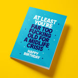 Same teal A5 card laid flat at an angle against the yellow background, showing the full card face. White and dark navy bold typography with sparkle details clearly visible. Clean product shot showing card size and print quality.