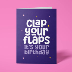 Purple birthday card with white text on a pink background