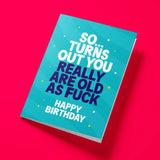 Rude birthday card reading So Turns Out You Really Are Old As Fuck on teal background
