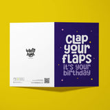 Greeting card with 'Clap your flaps, it's your birthday' text on a purple background, featuring the Wottahoot brand.