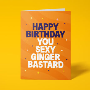 Orange rude birthday card with 'Happy Birthday You Sexy Ginger Bastard' message in dark blue and white lettering