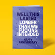 Purple anniversary card with white and lilac block-capital text reading "WELL THIS LASTED LONGER THAN WE FUCKING INTENDED, HAPPY ANNIVERSARY," decorated with hand-drawn stars, dots and sparkle icons.