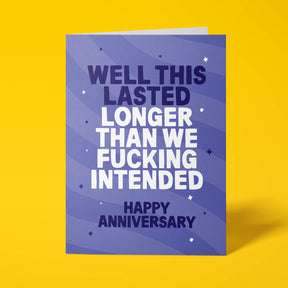 Purple anniversary card with white and lilac block-capital text reading "WELL THIS LASTED LONGER THAN WE FUCKING INTENDED, HAPPY ANNIVERSARY," decorated with hand-drawn stars, dots and sparkle icons.