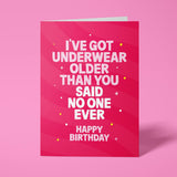 Vibrant pink rude birthday card featuring 'I've got underwear older than you' message in bold lettering