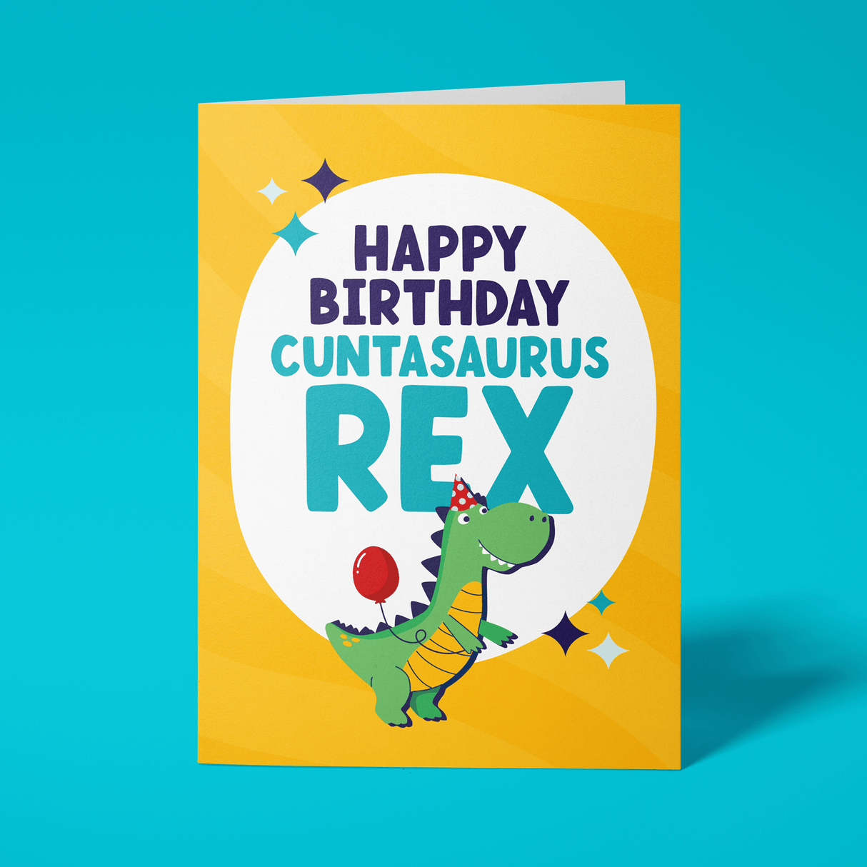 Rude birthday card reading 'Happy Birthday Cuntasaurus Rex' — yellow background with illustrated party dinosaur, bold navy and teal block text — Wottahoot