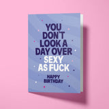Funny birthday card celebrating attractiveness with white envelope, ready to send