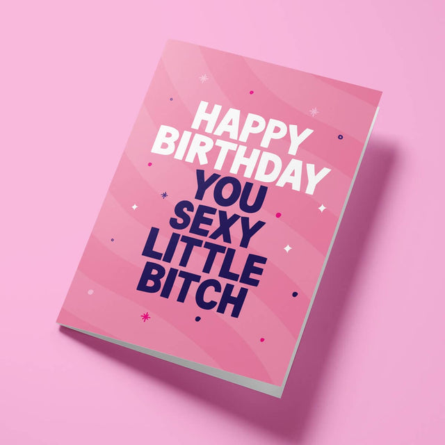Close-up of the cheeky text on premium gloss card with vibrant pink background