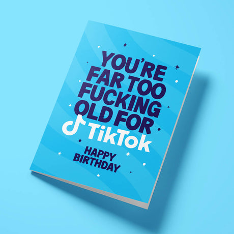 Blue birthday card with humorous text on a blue background