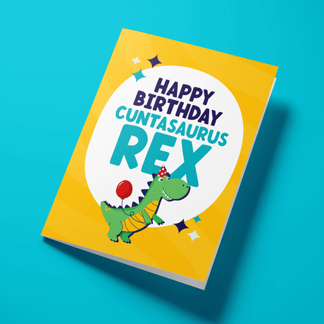 Funny rude birthday card with dinosaur illustration — yellow design, Cuntasaurus Rex bold typography — Wottahoot