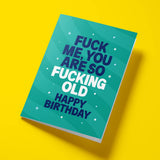 Close-up of the blunt age humour text on premium gloss card with green design